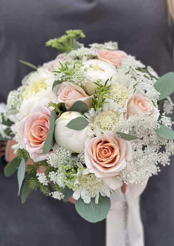 Brides-Peach-Roses-Peonies-and-Scabious-Bridal-Hand-Tied-scaled.jpg